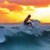 woman-surfing-sunset